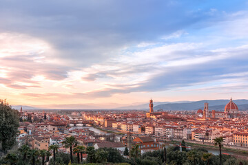 Fototapeta na wymiar Panoramic view over Florence and its famous landmarks at sunset. Palazzo Vecchio, Florence Cathedral, Ponte Vecchio. Tuscany, Italy