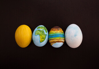 The planet Earth, and other celestial bodies, are drawn on the egg. Original idea for Easter.