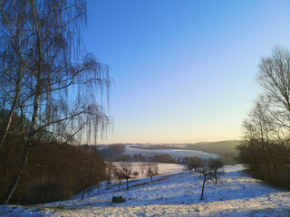 Beautiful sunrise over a snowy landscape near Duesseldorf, Germany