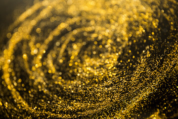 Glitter bokeh shiny background gold