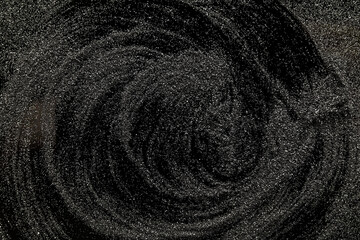 silver glitter on a black background