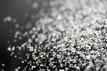 silver glitter on a black background