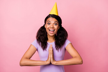 Photo of brunette tails hair afro american woman clap hands wish present wear cone hat isolated on...