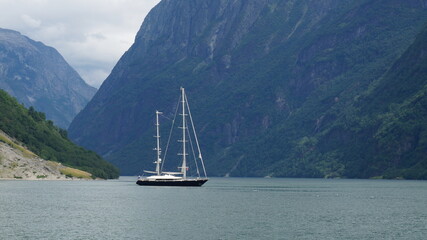 Naklejka premium sailing boat on the fjord