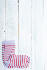 striped socks frame background on white wooden