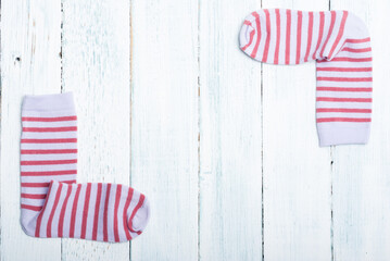 striped socks frame background on white wooden
