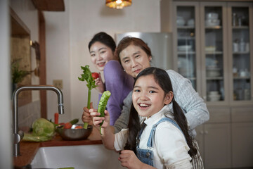 Helping hand. Cute Teenage Girl Help Her Mother In Washing Dishes At Family Kitchen