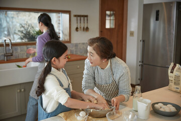 Helping hand. Cute Teenage Girl Help Her Mother In Washing Dishes At Family Kitchen
