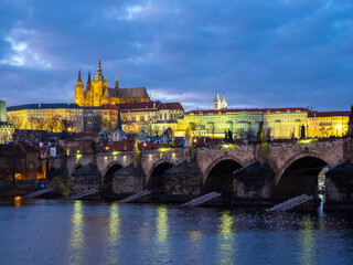 Fototapeta na wymiar Prague Castle and Charles Bridge in twilight. Prague, Czech Republic. December 10, 2019