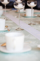 Winter cosiness, coffee in a white cup and sweeties on a light background. High quality photo