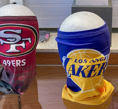 FRESNO, UNITED STATES - Feb 10, 2021: Photo Of A S.F. 49ers And L.A. Lakers Face Masks On Mannequin Heads