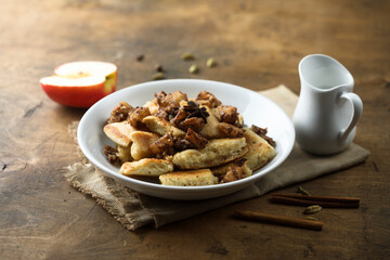 Traditional Austrian pancake dessert with apple and raisins