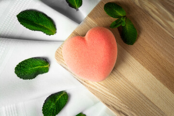 raspberry chocolate cake on a board with mint