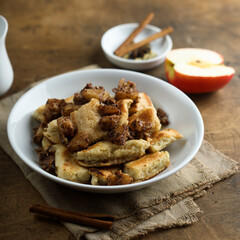 Traditional Austrian pancake dessert with apple and raisins