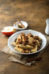 Traditional Austrian pancake dessert with apple and raisins