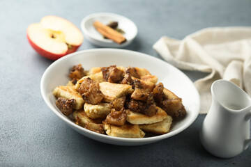 Traditional Austrian pancake dessert with apple and raisins