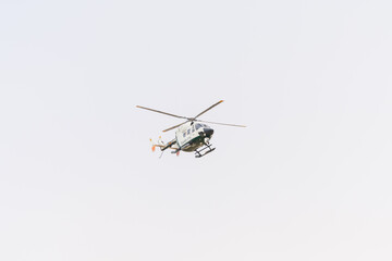 a Spanish Guardia Civil helicopter flying overhead © makasana photo