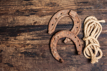 Cast iron metal horseshoes and rope