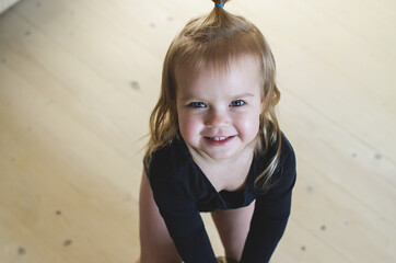Funny little ballerina waiting for lesson at home. Cute dancer relax before exercising. Practicing...