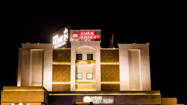 Front view of Amrik Sukhdev Dhaba at night, large multi-cuisine restaurant