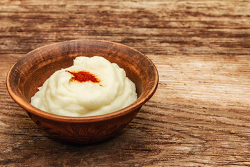 Mashed potato in antique ceramic bowl