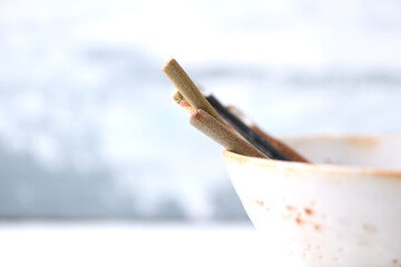 Traditional ceramic bowl on bright background. Copy space.