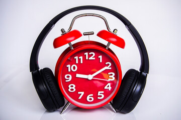 Retro alarm clock and headphone with white background