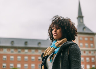 Woman with pensive and optimistic look