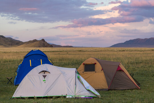 Camping in the middle of the steppe. Beautiful sky at sunset, Kazakhstan, Kegen