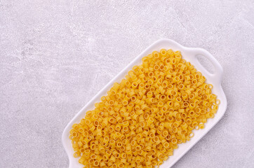 Dry pasta in a ceramic dish