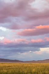 Amazing sunset sky with clouds under the steppe, Kazakhstan, Kegen