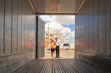 Group of Asian teamwork of workers people team company working in cargo container warehouse...