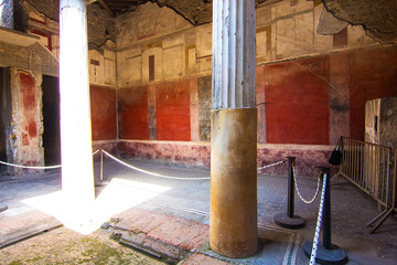Interior of an ancient house with frescoes and columns at Pompeii destroyed by the eruption of...