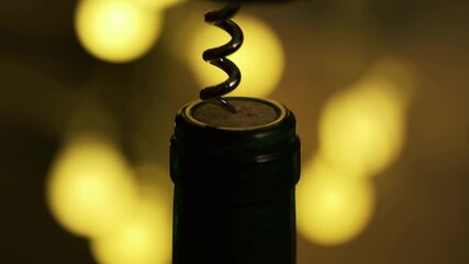 Opening Wine Bottle with Corckscrew. Romantic Atmosphere for Dinner at Restaurant. Bokeh Background and Low Key Lighting. Macro Shot. B Roll.