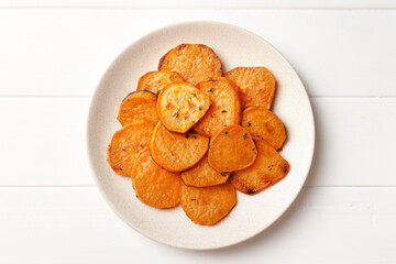 Plate with tasty cooked sweet potato on table
