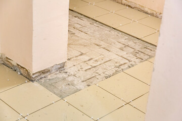 Textured surface of dirty tile during unfinished floor renovation in a building
