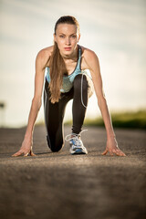 Young woman running ,  preparing for the run. 