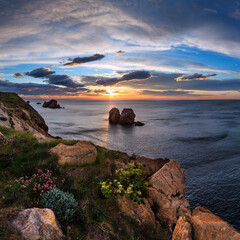 Sunset blossoming Atlantic Ocean beautiful coastline landscape (Arnia Beach, Biskaya, Cantabria, Spain). Two shots stitch image.