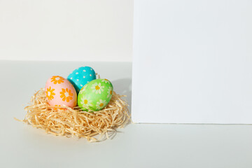 Decorated Easter eggs in the nest on a white background. Concept, copy space.