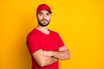 Profile side view portrait of attractive virile content guy mailman folded arms best service isolated over bright yellow color background
