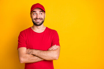 Portrait of nice funky content cheerful guy mailman folded arms looking aside copy space isolated...