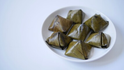 Stuffed dough pyramid dessert called Ka-Nhom-Tian isolated on black background, Thai dessert ...