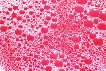 red background with foam and bubbles