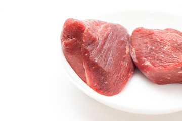 Raw fresh beef meat pieces on plate