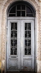 Fototapeta na wymiar vintage entrance wooden white door with glass