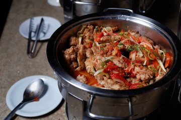 spicy sausage pau de angu served in a pan