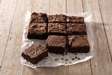 Homemade pieces of brownies on wooden table	