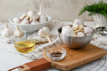 Bowls with fresh garlic on table