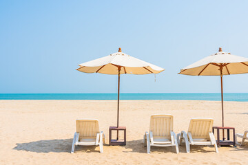 Umbrella and chair around beach sea ocean on blue sky