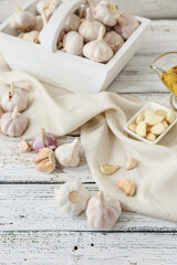Fresh garlic on light wooden background